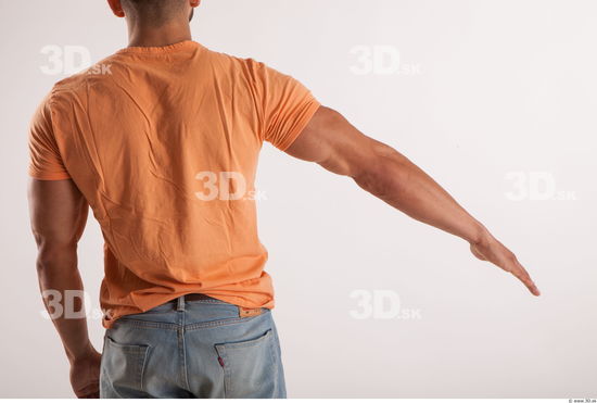 Arm moving pose orange thsirt of bodybuilder Harold