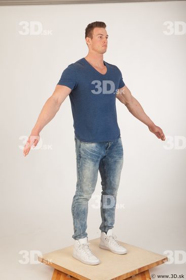 Whole body blue tshirt light blue jeans modeling a pose of Andrew