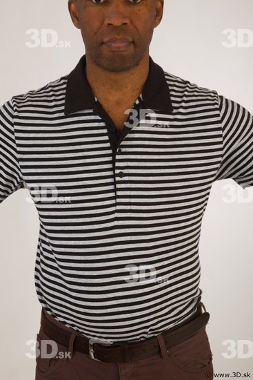 Upper black white striped shirt brown jeans of Arturo