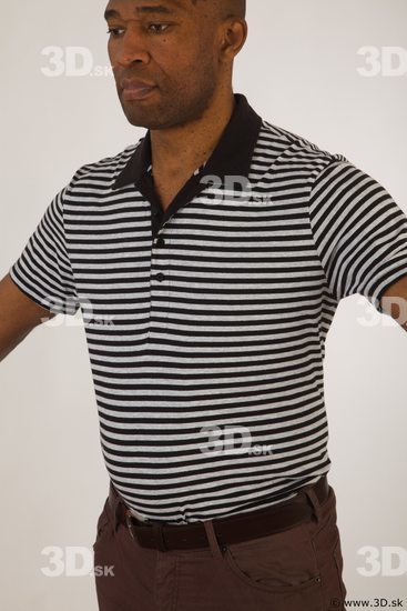 Upper black white striped shirt brown jeans of Arturo