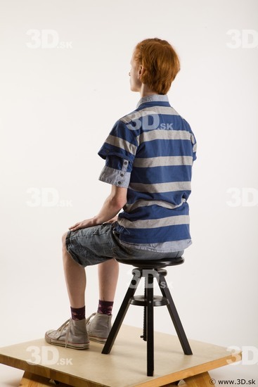 Sitting reference of whole body striped blue gray shirt blue jeans shorts black gray shoes Wesley