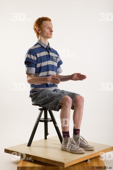 Sitting reference of whole body striped blue gray shirt blue jeans shorts black gray shoes Wesley