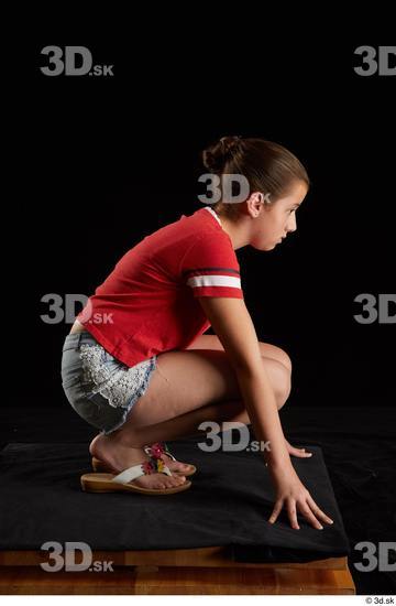 Whole Body Woman White Shirt Jeans Shorts Average Kneeling Studio photo references