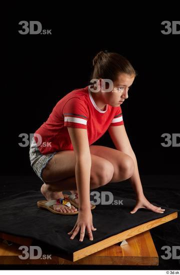 Whole Body Woman White Shirt Jeans Shorts Average Kneeling Studio photo references