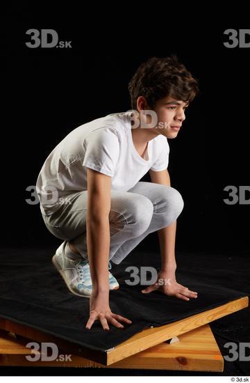 Whole Body Man White Sports Shirt T shirt Sweatsuit Kneeling Studio photo references