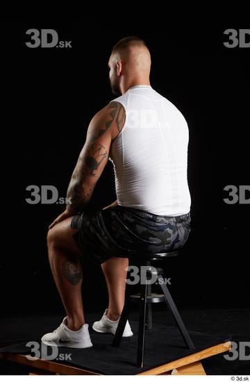 Whole Body Man White Sports Shorts Muscular Sitting Top Studio photo references