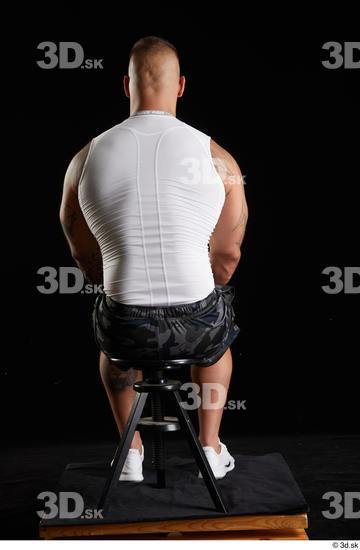 Whole Body Man White Sports Shorts Muscular Sitting Top Studio photo references