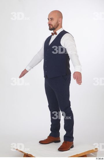 Neeo blue trousers blue vest brown oxford shoes business dressed red bow tie standing white shirt whole body  jpg