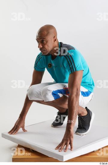 Whole Body Man Black Sports Shirt Shorts Slim Kneeling Studio photo references