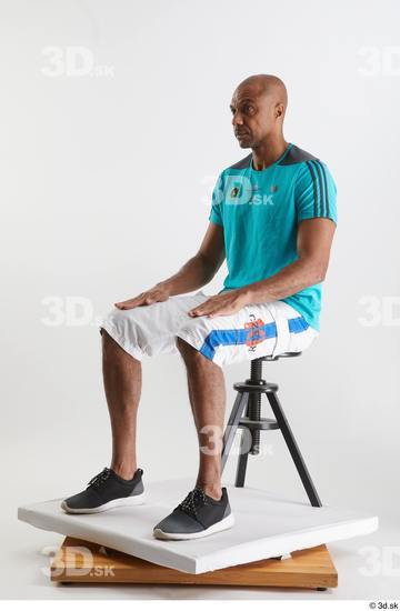 Whole Body Man Black Sports Shirt Shorts Slim Sitting Studio photo references