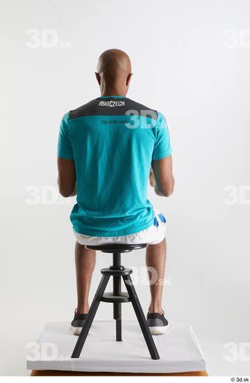 Whole Body Man Black Sports Shirt Shorts Slim Sitting Studio photo references