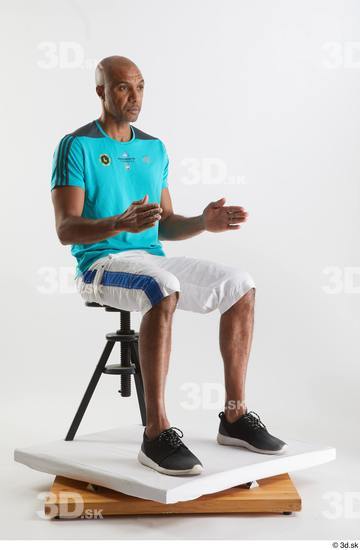 Whole Body Man Black Sports Shirt Shorts Slim Sitting Studio photo references