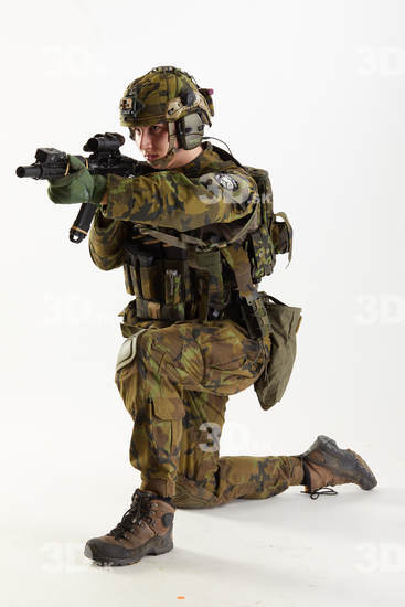 Weapons-Rifle Man Pose with machine rifle White Uniform Athletic Studio photo references