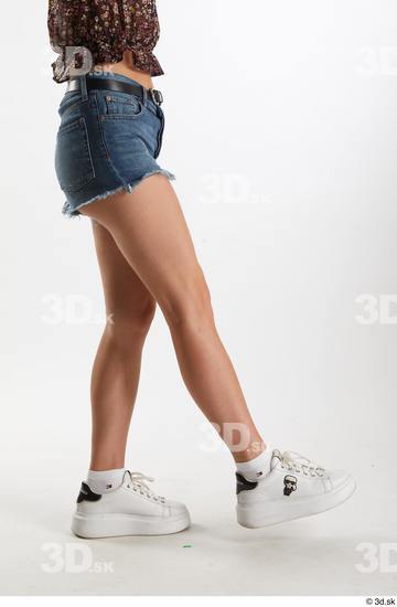 Arina Shy  blue jeans shorts casual dressed leg lower body side view white sneakers  jpg
