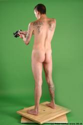 Whole Body Man Pose with pistol White Tattoo Nude Underweight Male Studio Poses