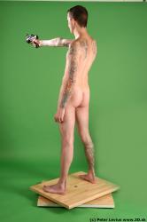 Whole Body Man Pose with pistol White Tattoo Nude Underweight Male Studio Poses