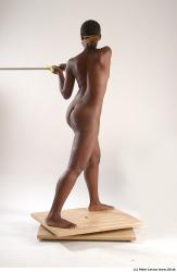 Whole Body Woman Pose with sword Black Nude Athletic Studio photo references